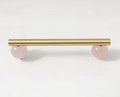 Silky matte gold brass bar handle resting on semi precious stone balls/colourful cabinet handle/stone furniture hardware/crystal drawer pull