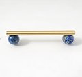 Silky matte gold brass bar handle resting on semi precious stone balls/colourful cabinet handle/stone furniture hardware/crystal drawer pull
