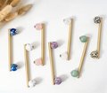 Silky matte gold brass bar handle resting on semi precious stone balls/colourful cabinet handle/stone furniture hardware/crystal drawer pull