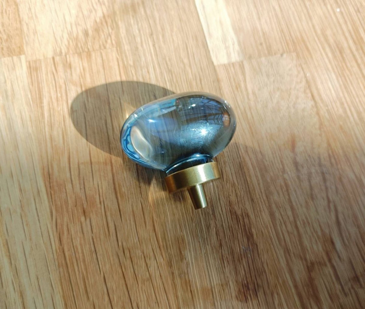 Grey oval crystal and brass cabinet pull/Retro cool grey egg shape crystal drawer knob/mid century style smooth polished crystal door handle